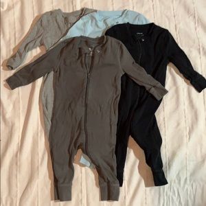 Lot of primary footless zip rompers